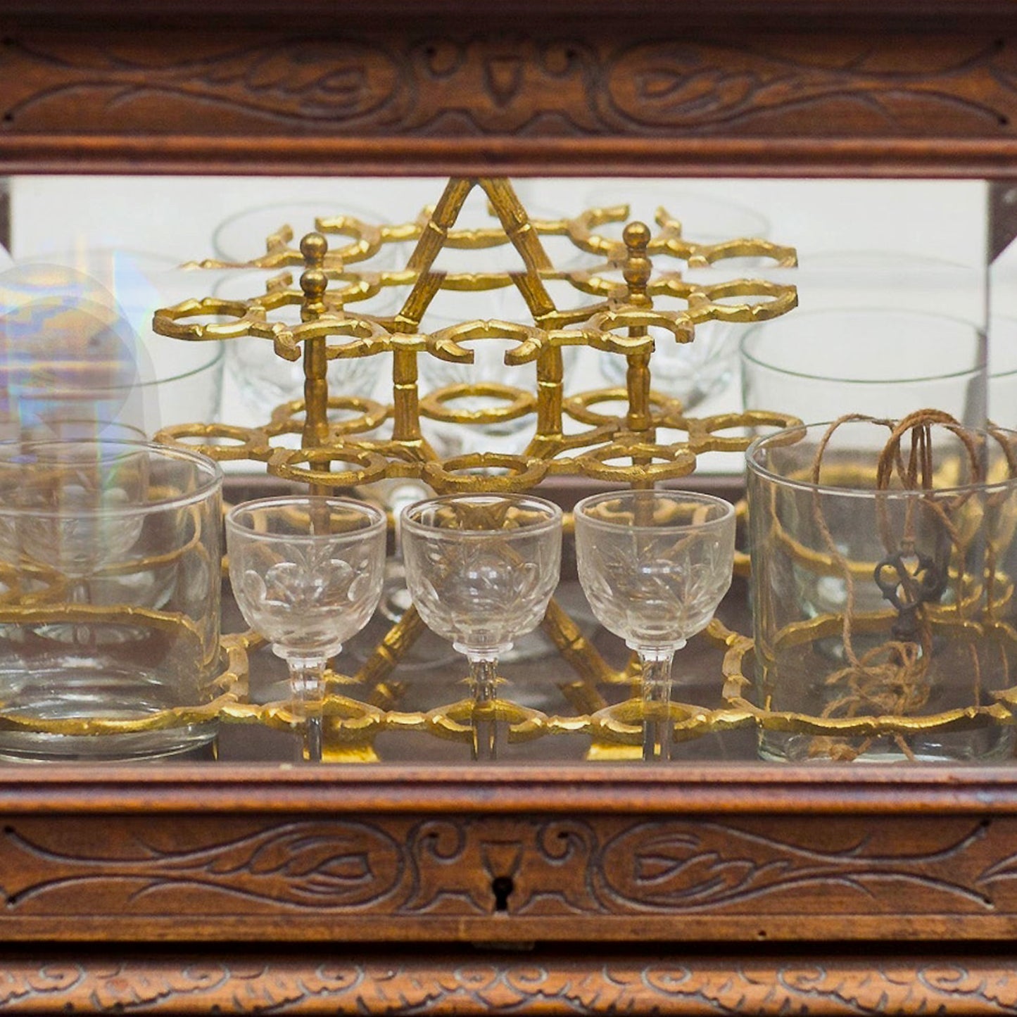 close up of Vintage Oak Tantalus with Original Glasses