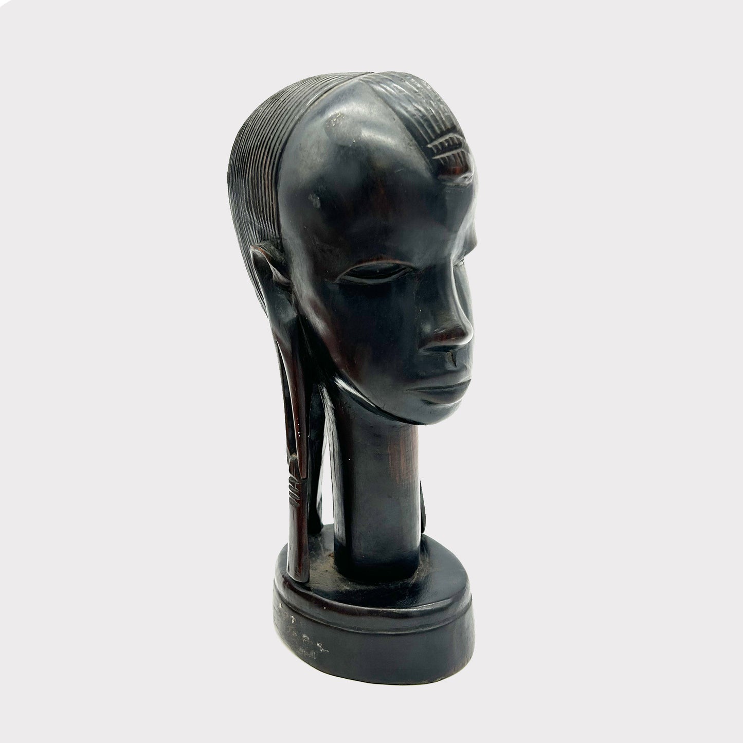 partial front view of a Vintage Carved African Ebony Bust