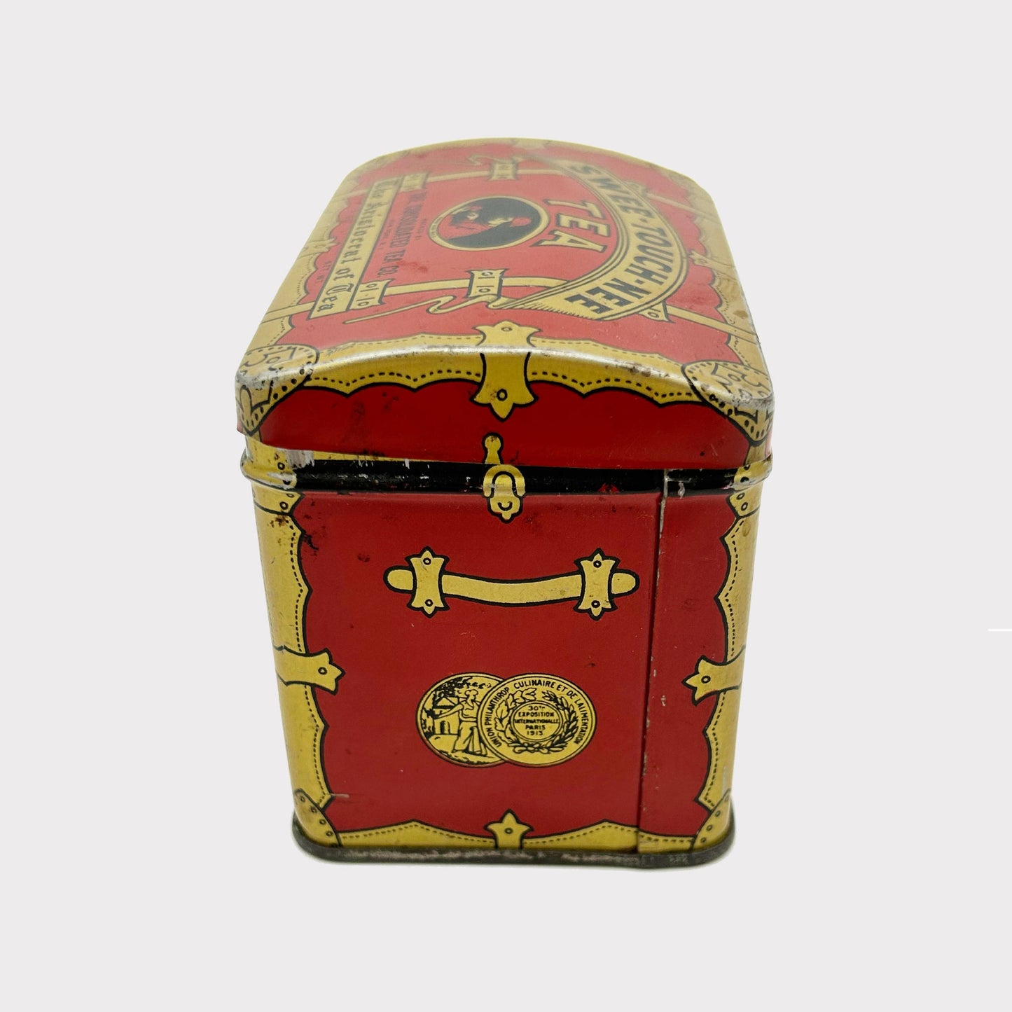 side view of Antique Swee-Touch-Nee Tea Container
