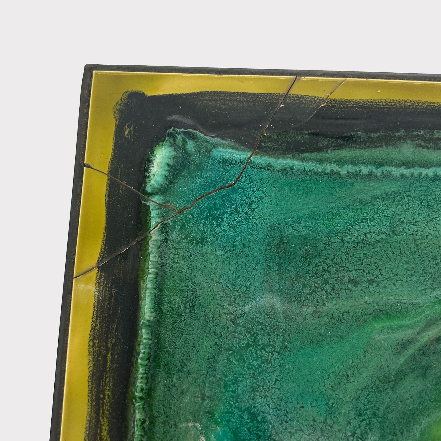 damage view of side Table with multicolored tiles on the top