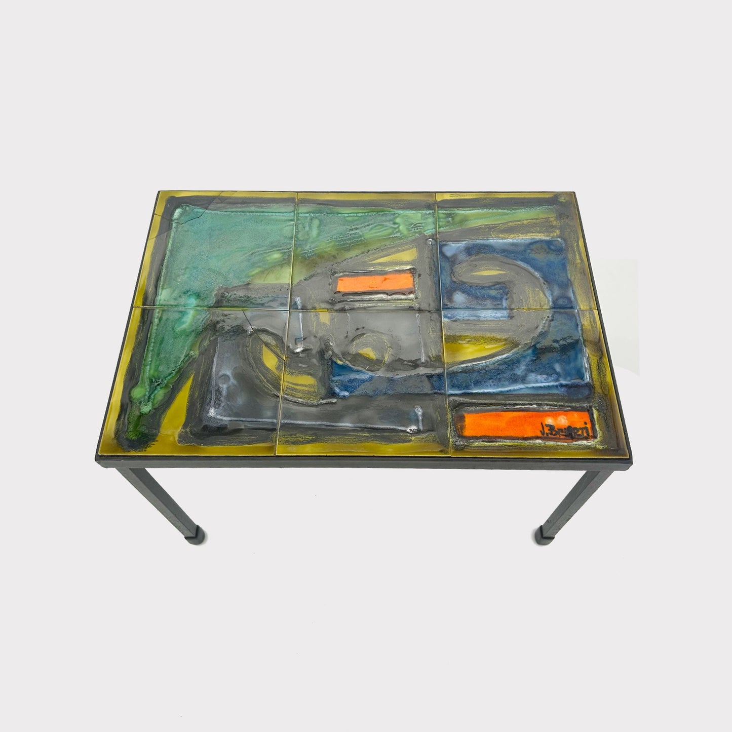 Angular view of side Table with multicolored tiles on the top