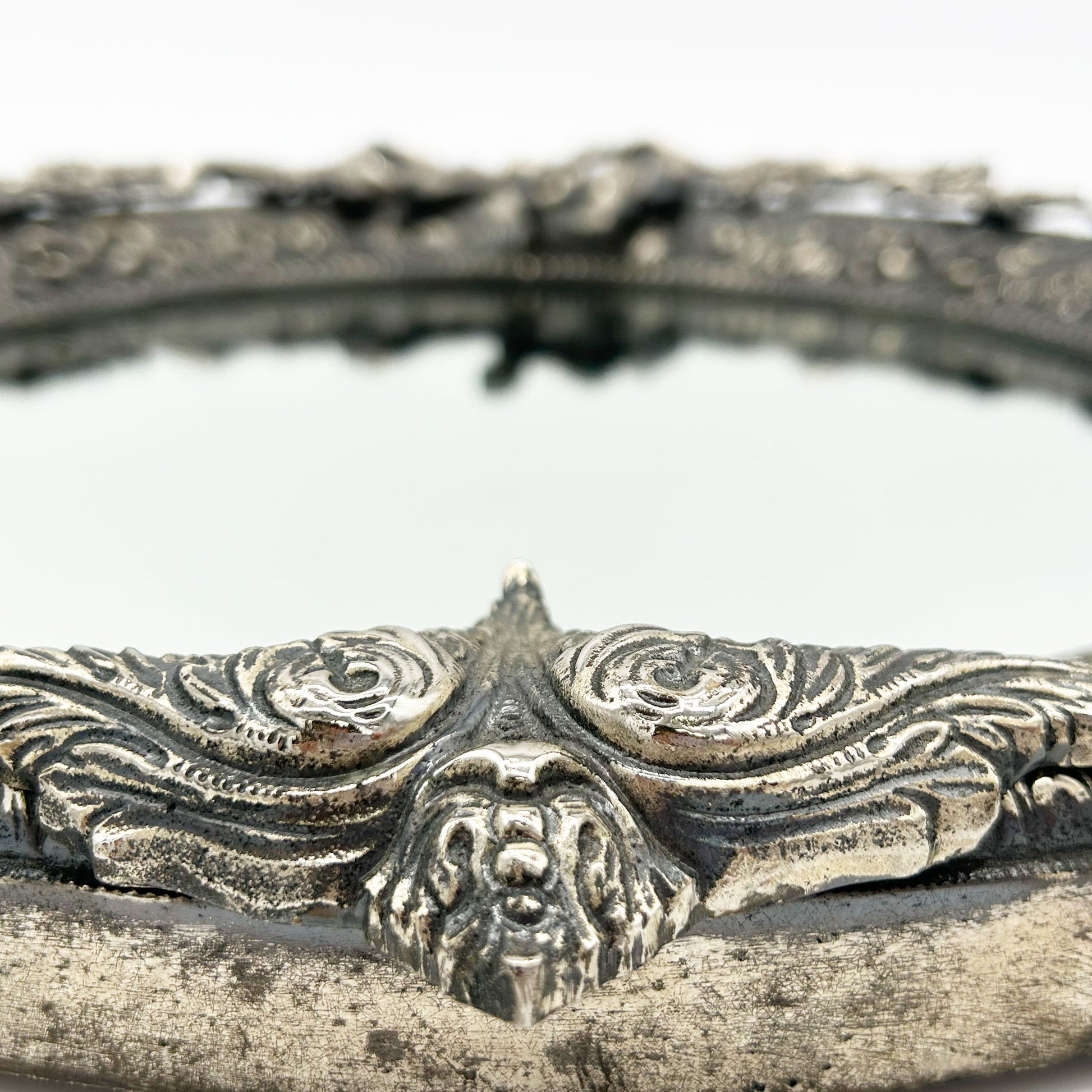 casting detail of Vintage French Pewter Mirror with Bow Detail