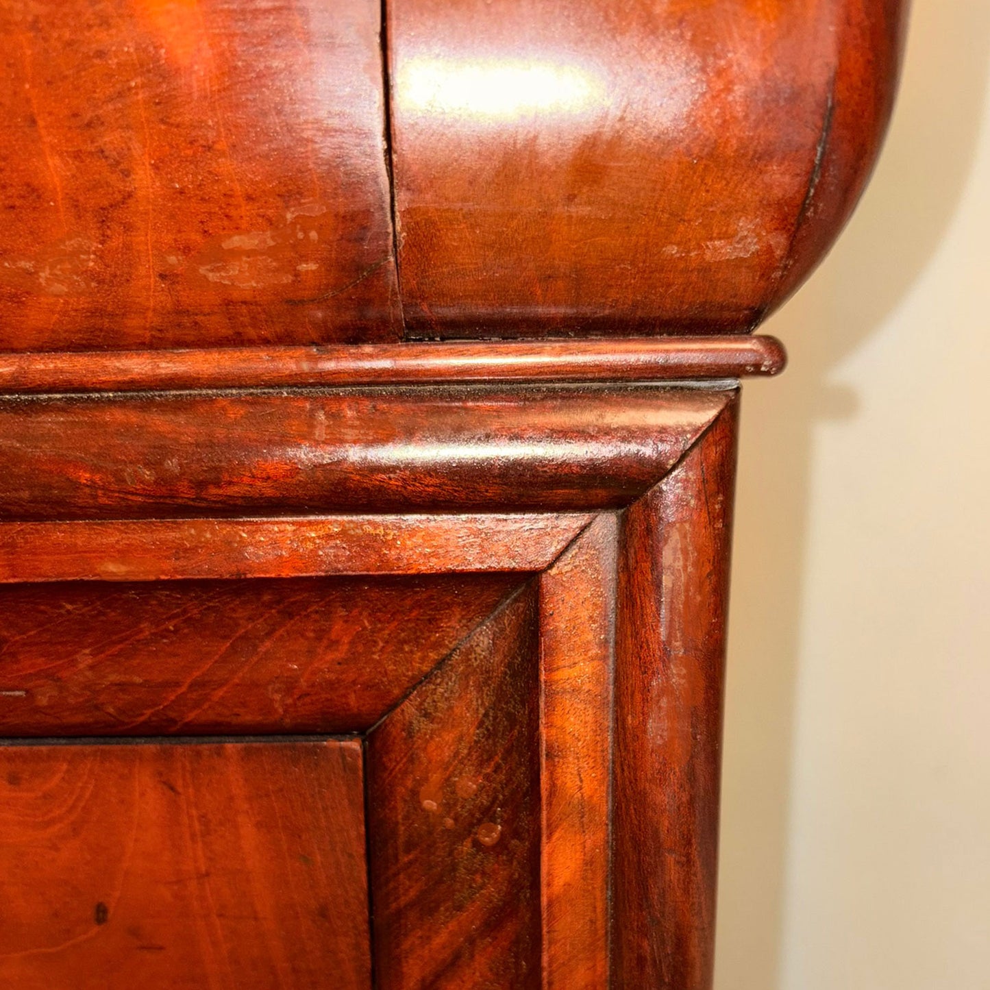 Close-up of a wooden cabinet with a focus on the corner.