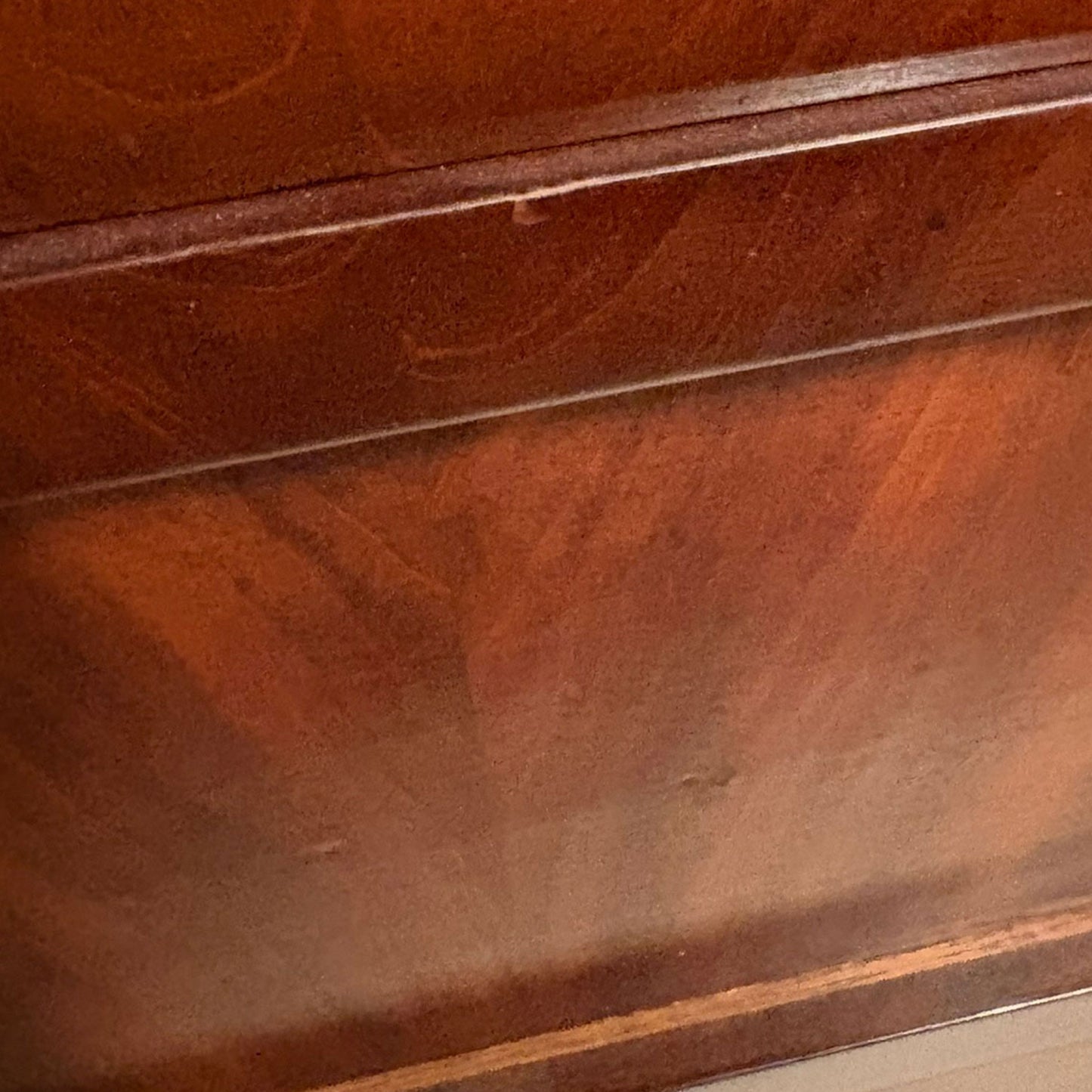 close up image of a side of a wooden dresser
