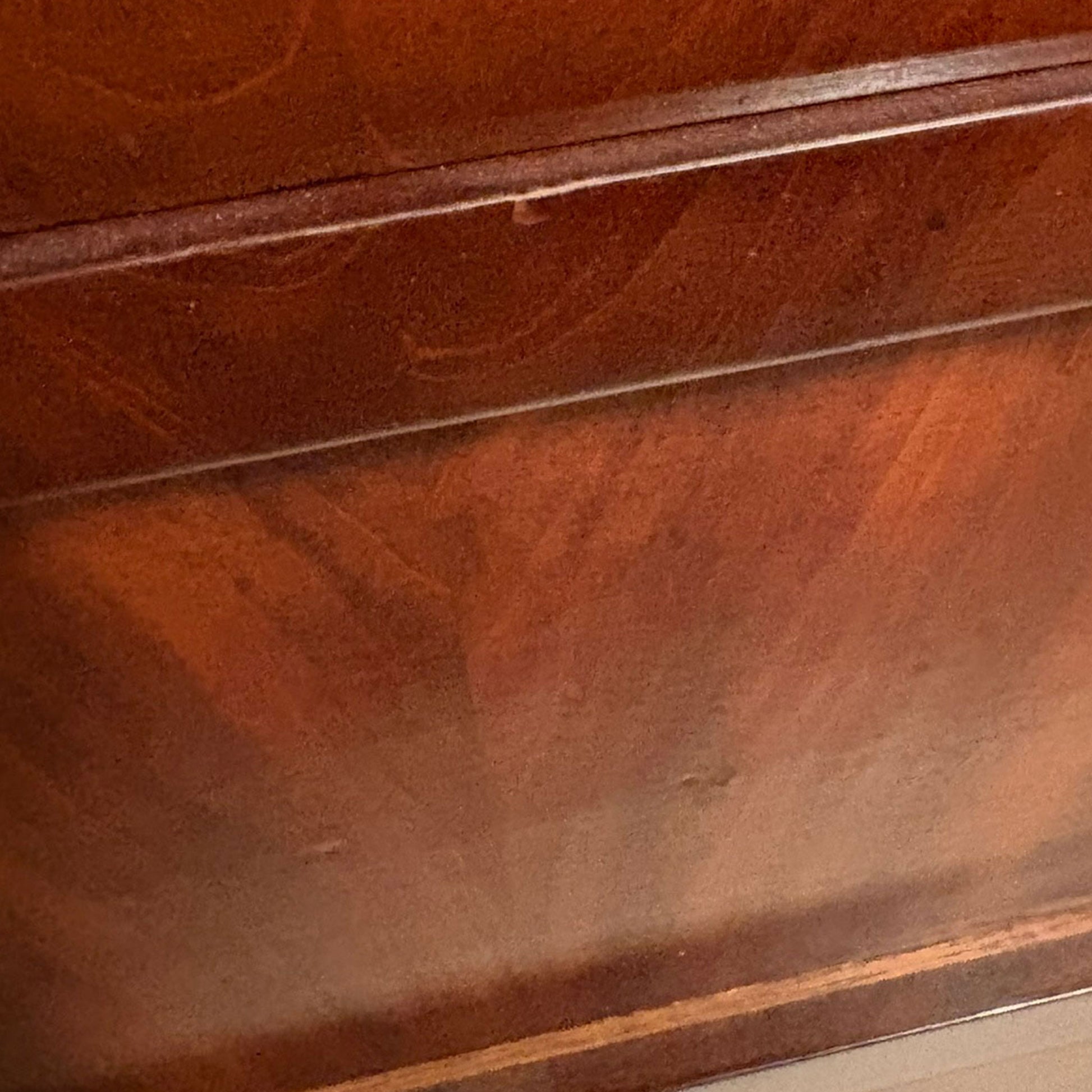close up image of a side of a wooden dresser