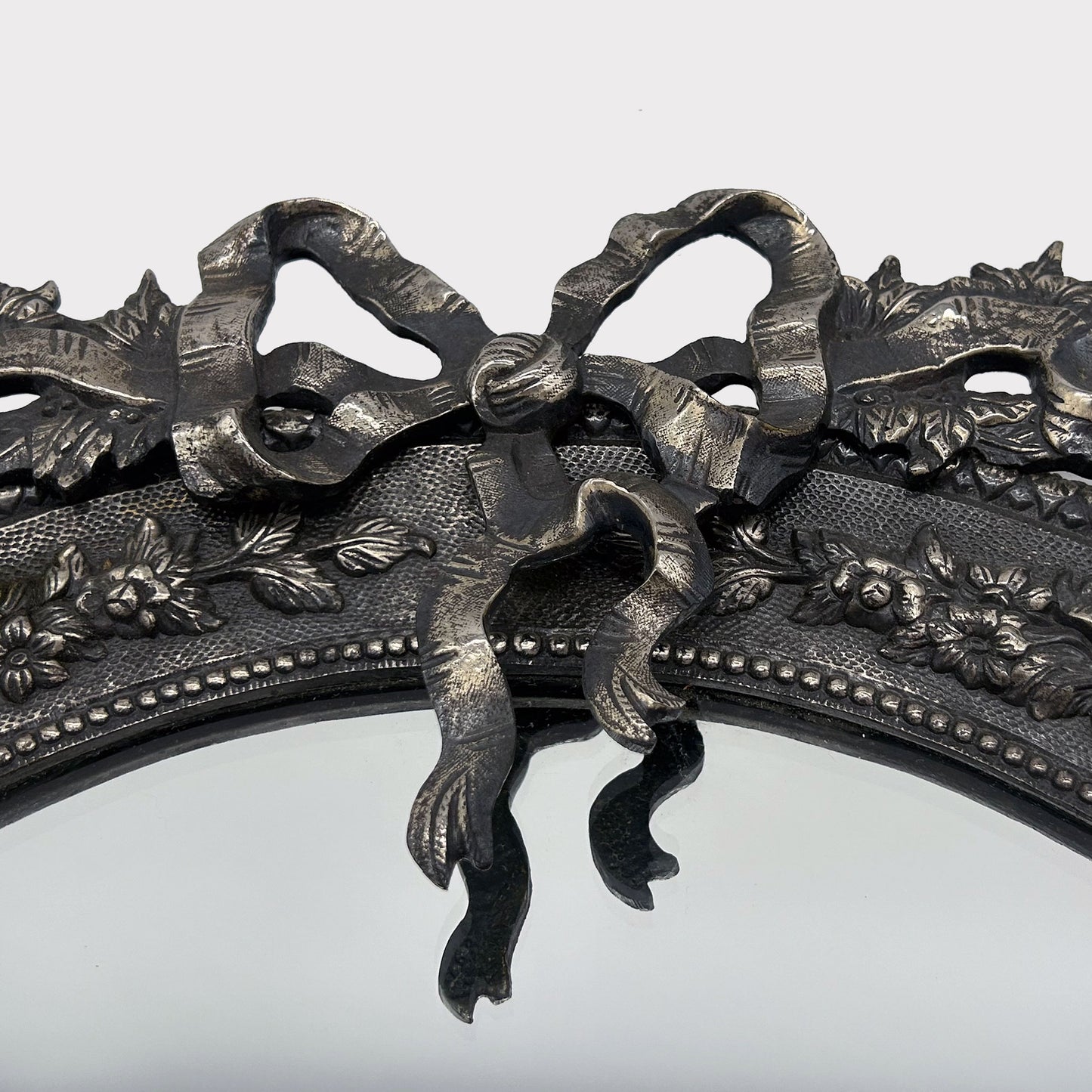 Bow detail image of Vintage French Pewter Mirror with Bow Detail