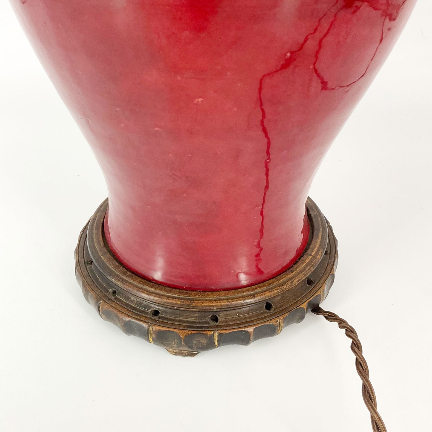detail view of Red Mid Century Lamp on Wood Base