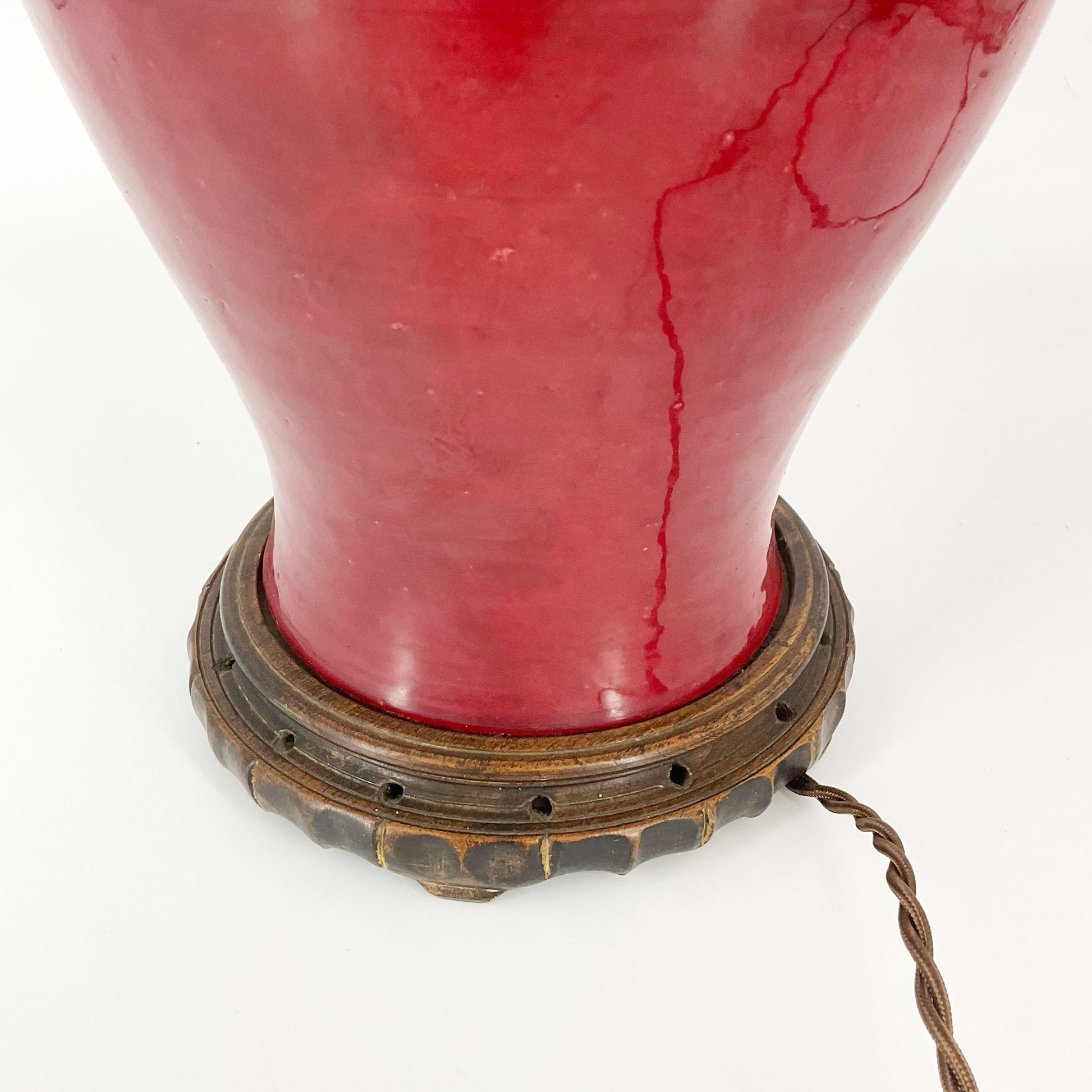 detail view of Red Mid Century Lamp on Wood Base